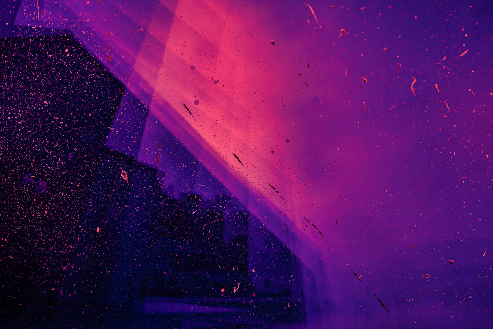 Abstract violet and pink light glowing in the dark